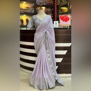 Beautiful party wear saree in lilac/lavender color.